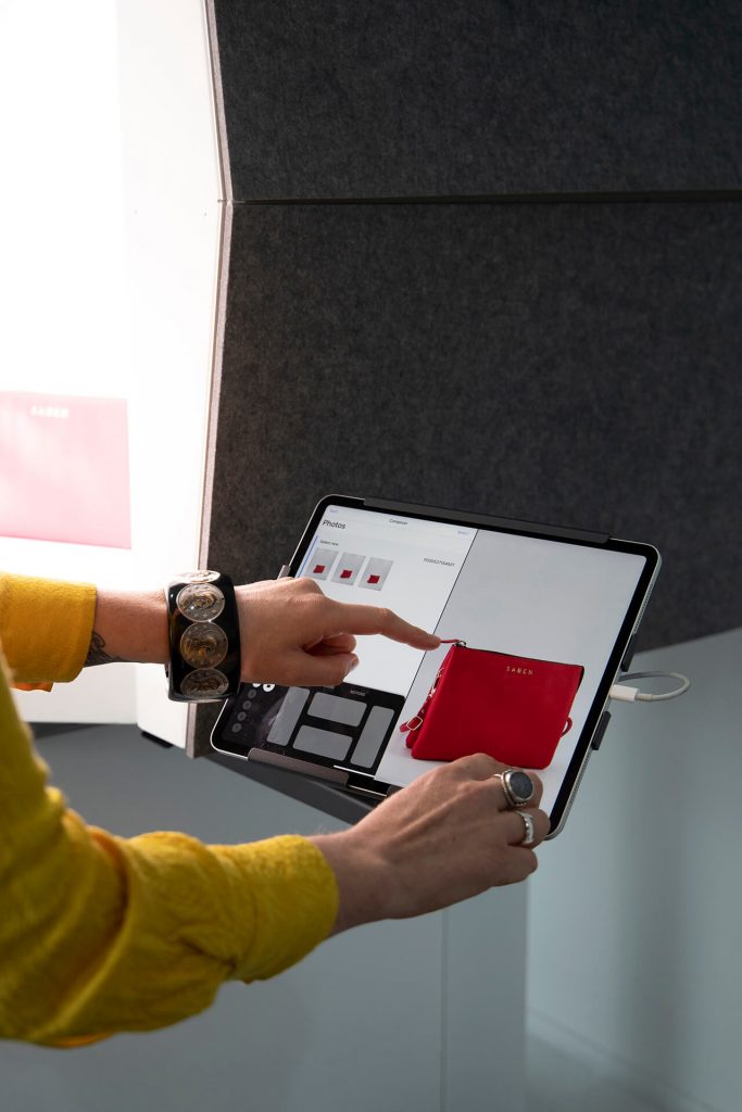 iPad Live view showing a photograph of a fashion bag captured by automation photography tools